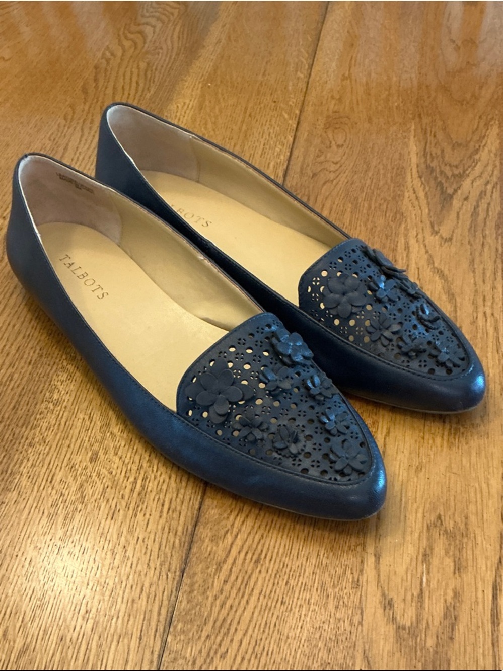 Woman’s Talbots navy leather flat. Size 9. Cut out on top with leather flowers!